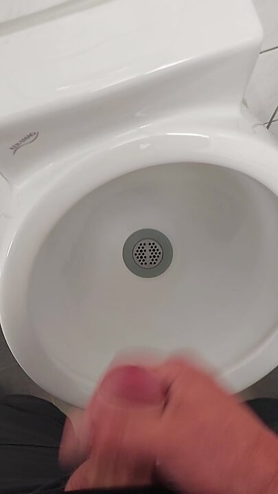 Moaning daddy has a lot of pressure and milks his cock in the public toilet