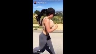 Bouncing her Titties while jogging. 