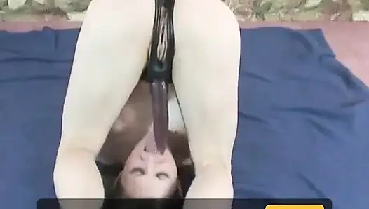 Lusty blond nympho sucks a strap on before masturbating