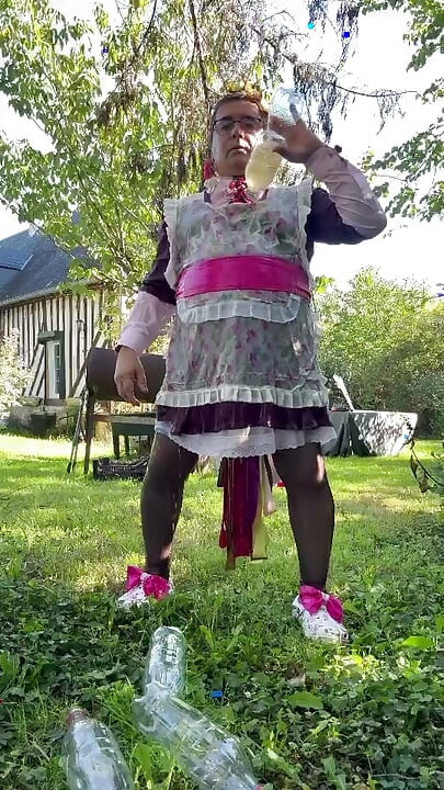 In gardener's outfit to take a piss shower with 4 bottles