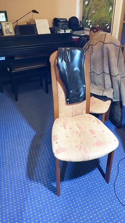 the latex slave has to do it himself