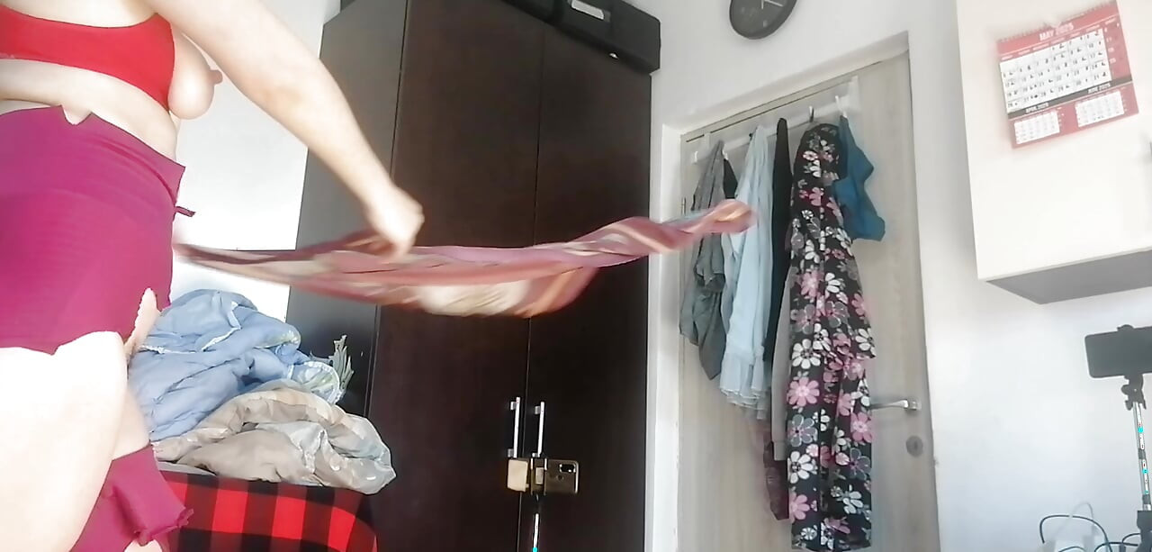 Amateur wife has fun trying on clothes and cutting them. Amateur wife vacuuming naked in the house.