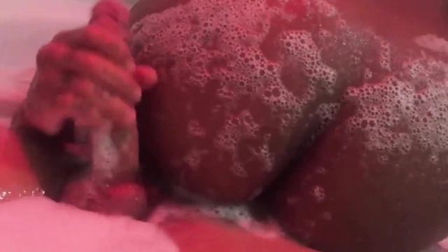 Eating brunette's big ass in the bathtub
