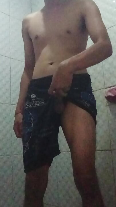 standing jerking off in a public toilet