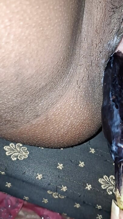 Desi girl masturbates with eggplant and moans loudly