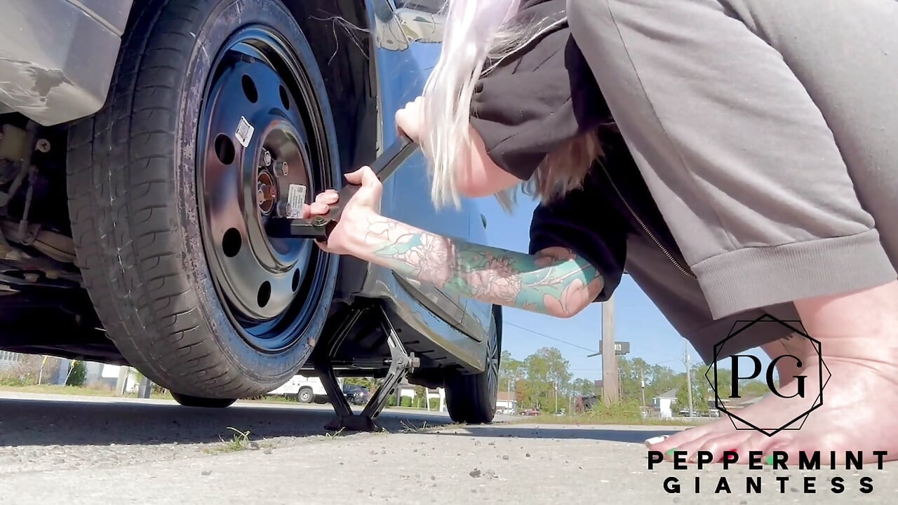 67 Tall Amazon Goddess Changes Her Tire - Big Feet in Frame