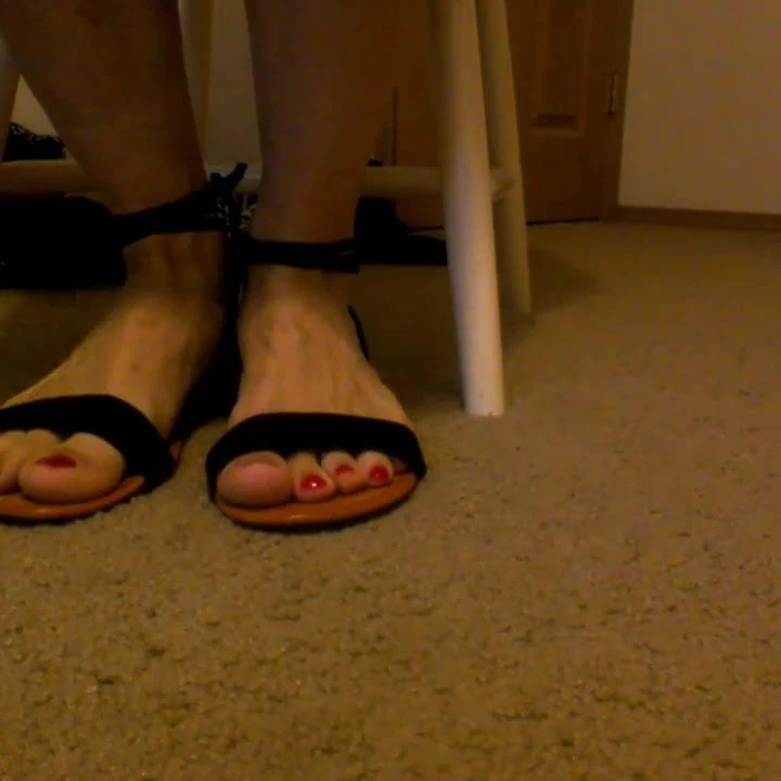Red toes in sandals