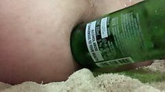 Beer bottle insertion into ass