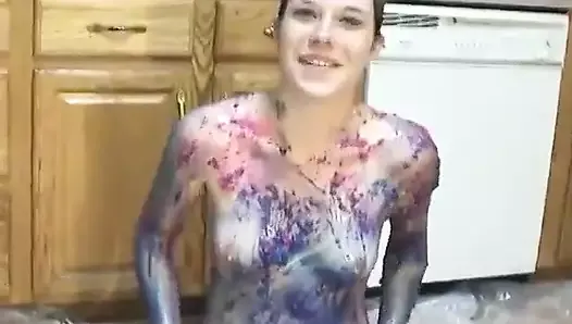 Teen chick strips and plays in puddle of body paint on the kitchen floor