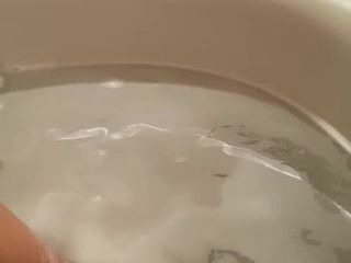 Wife jilling in the bathtub