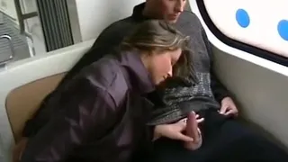 She sucks his cock inside a train