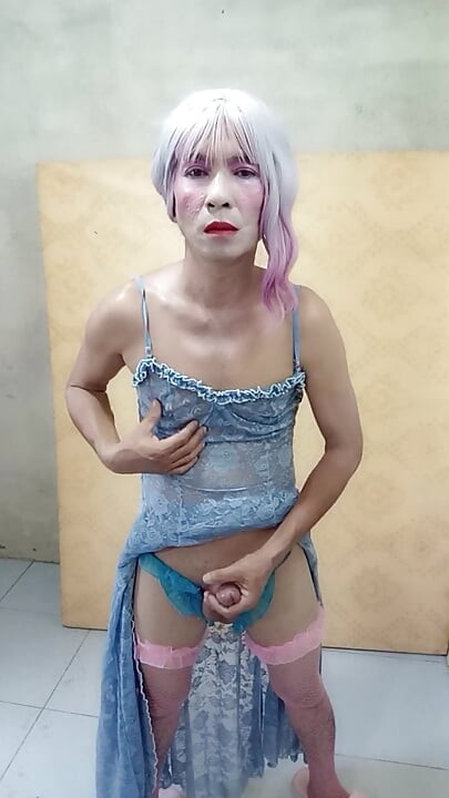 Oanh Le shemale eyes sexy dress porn standing with a happy cock leaning on her back