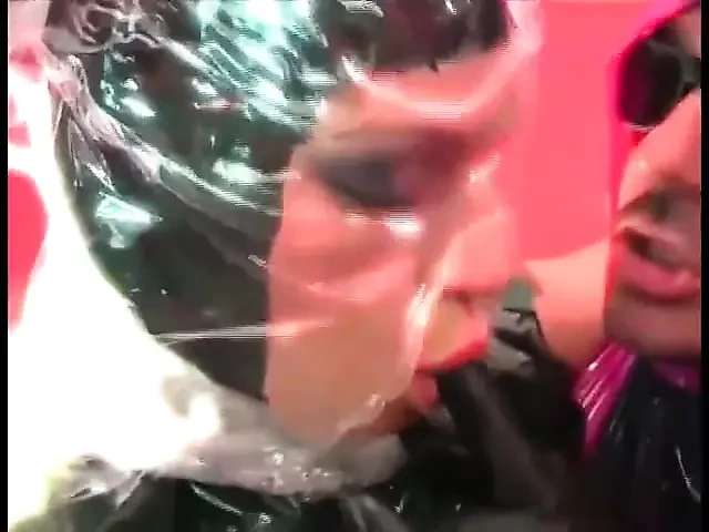 Two slutty slaves in latex sucks a hard big cock