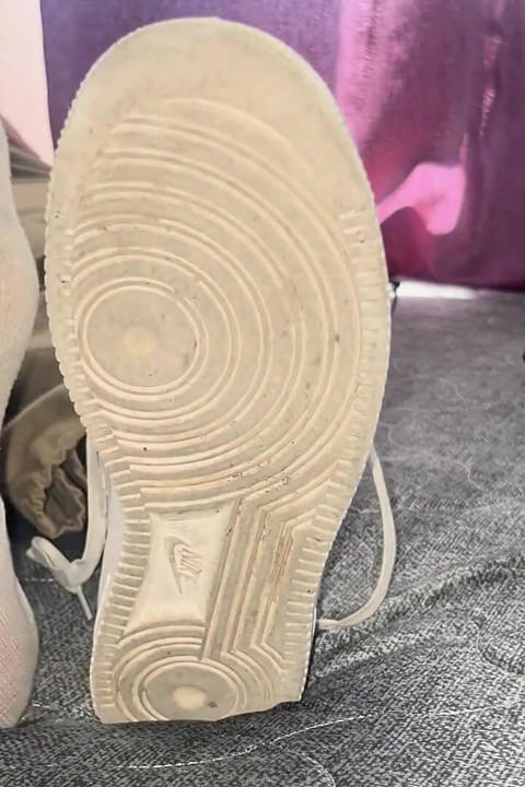 A University Rests Her Feet on Her Face so That the Adorers