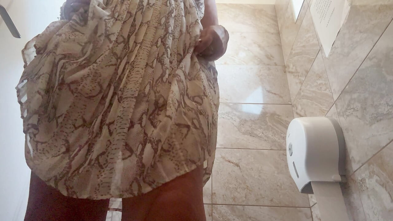 Sexy MILF Michelle arrives at the office horny and rubs her pussy until she cums in the public restroom.