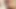 Long-haired Asian shemale in colorful bikini jerks off her