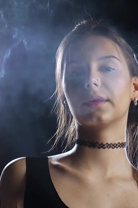 Brunette Smoking in Black Latex Outfit Slow Sensual Scene