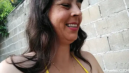 Amateur wife teasing you outside wearing a micro bikini