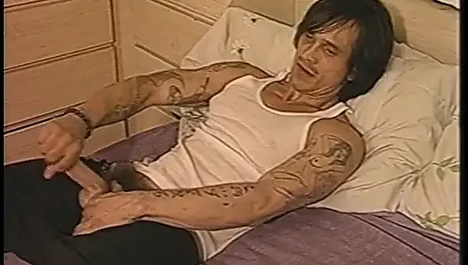 Blonde guy sucks another dude's cock before brunette vixen fucks him with a strap on