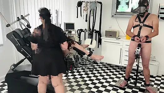 Strapped Mature Slave Fingered Deep in Fetish Clinic Orgy