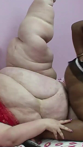 Captivating moment from "Extremely fat black and white women at rare Lesbian Sex"