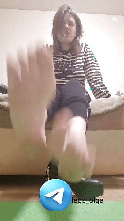 The girl makes you lick your feet and shoes. Sweet femdom