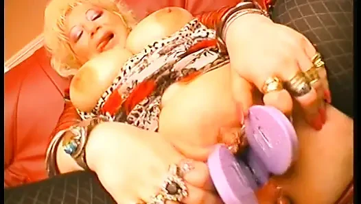 Nasty granny puts anything she can find in her pussy