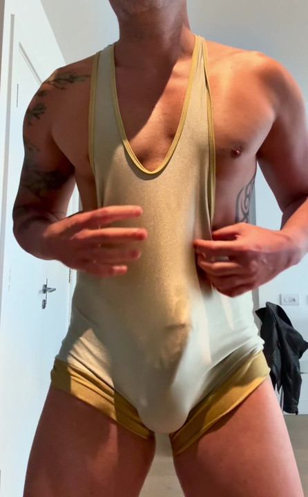 Muscle gym bro plays with his big cock in wrestling singlet