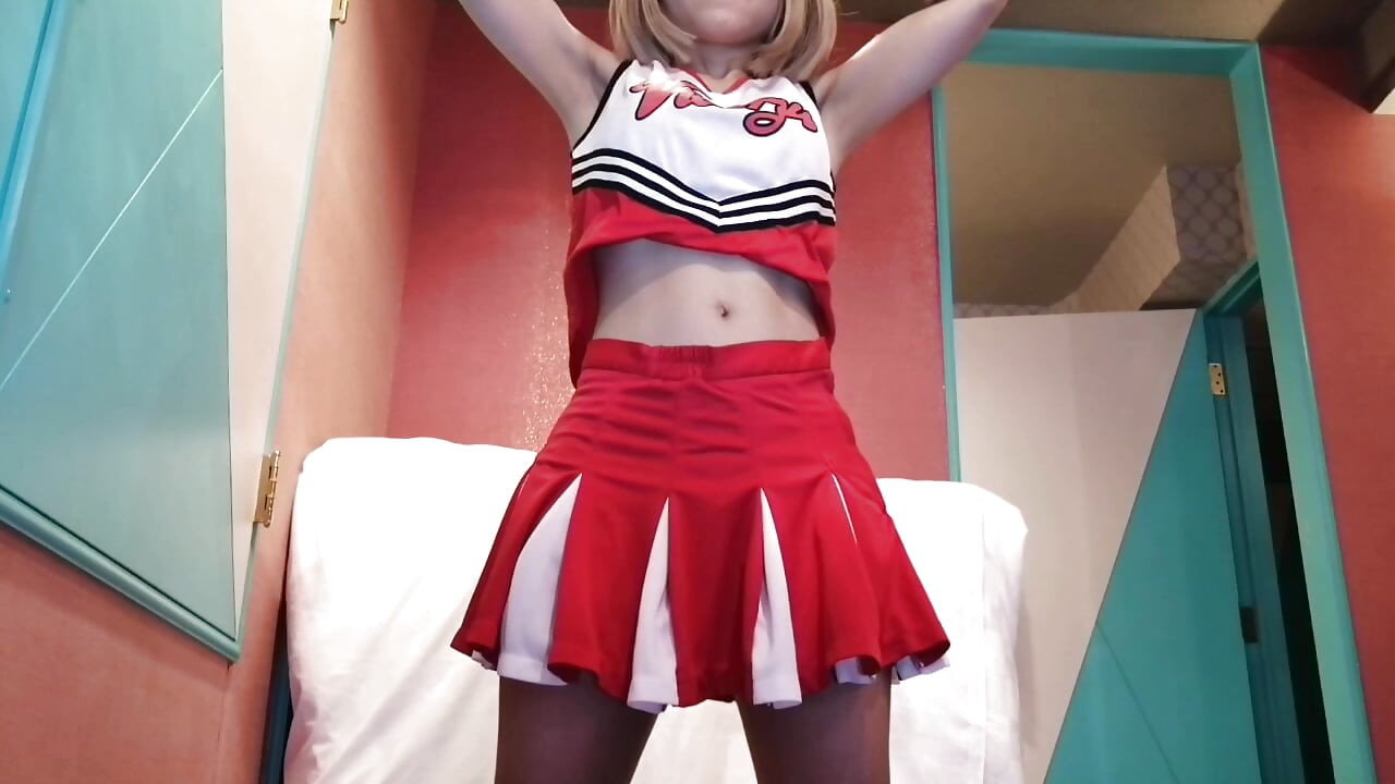 A cute, busty married woman does five exercises in a sexy cheerleader costume. Peeking down from below. Home made amateur Private Shoot