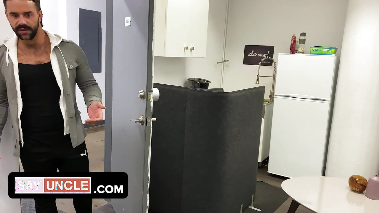 Two muscular coworkers are stuck in the office during lockdown and find a distraction from boredom