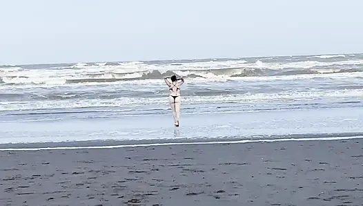 My neighbor loses her clothes at the beach.