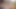 A video of a cross-dresser wearing a dress quietly masturbating