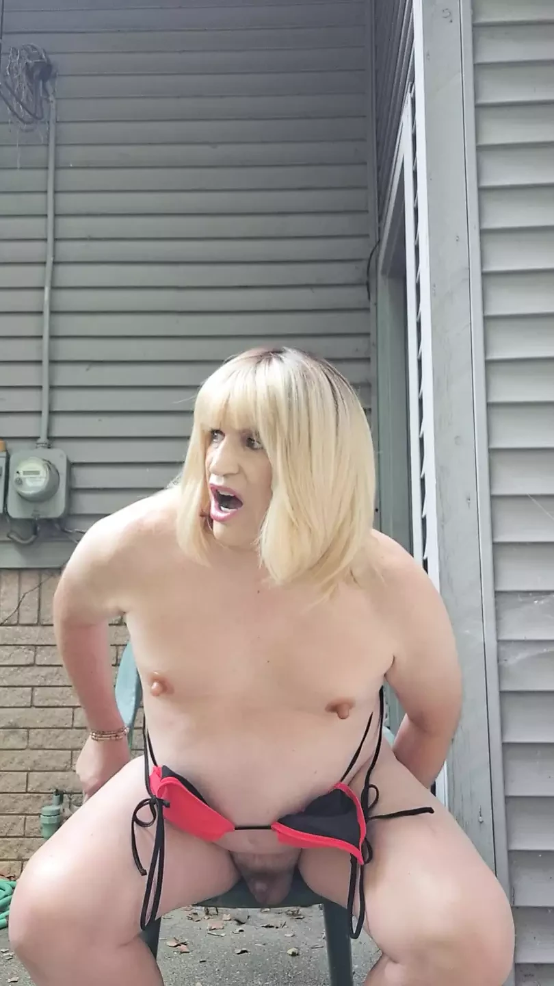 Outside on the patio, taking a dildo up the ass!
