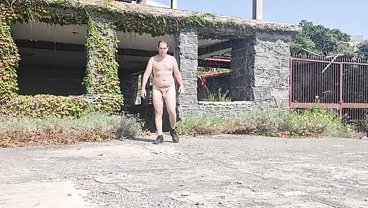 Boy completely naked near the sea