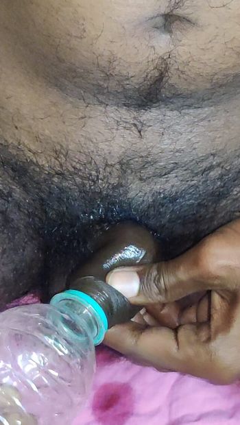 Asian Desi boy trying to fuck bottle with oil