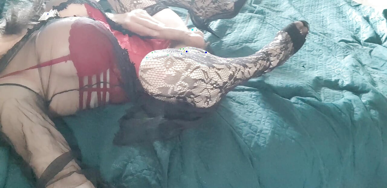 I'm wearing a red bodysuit, black stockings and a sexy robe.