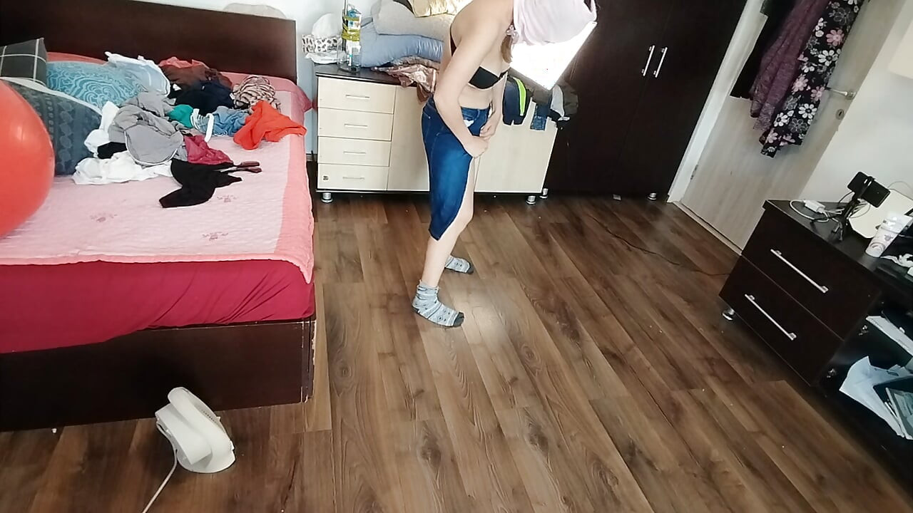 Amateur wife enjoys trying on clothes and cutting them.