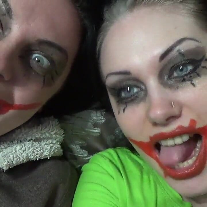Two crazy clown girls dangle you above their hungry mouths before fighting over who will eat you alive