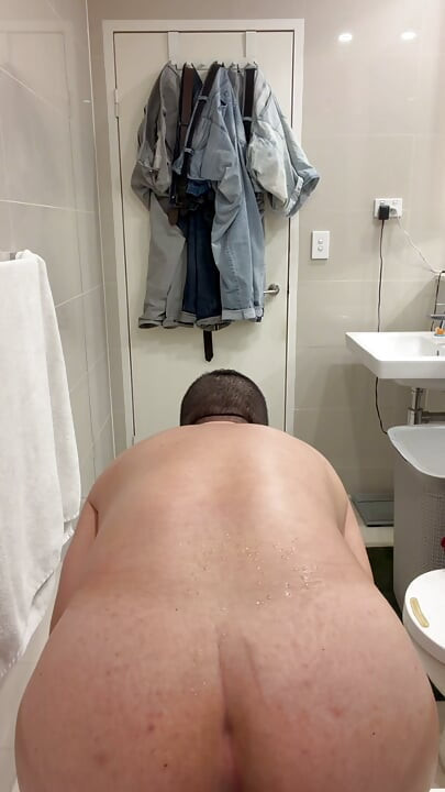 Chastity sub stretching hole with toy and nipples clamps