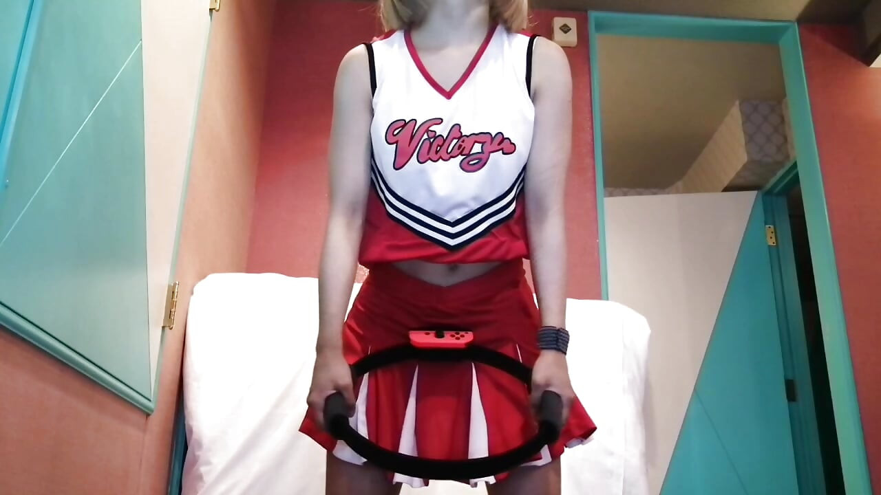 A cute, busty married woman does five exercises in a sexy cheerleader costume. Peeking down from below. Home made amateur Private Shoot