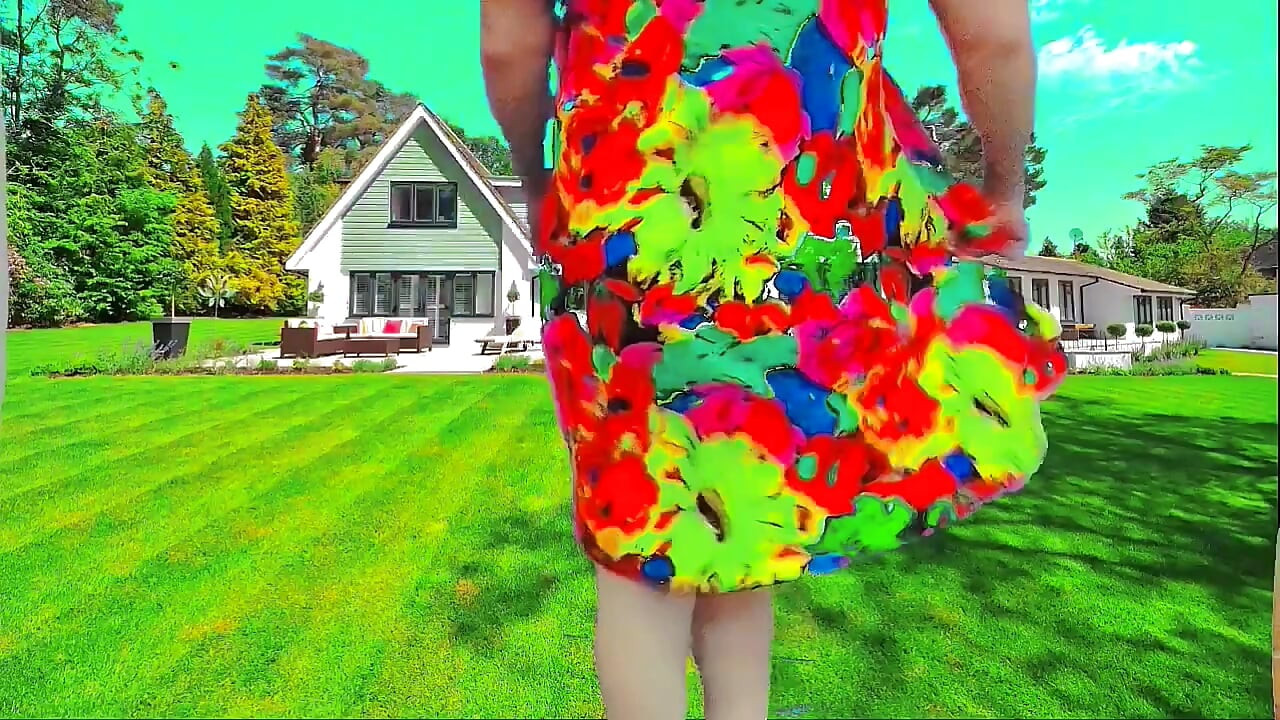 Sweet shemale walking through garden in summer breeze