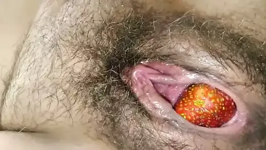 Ripe strawberry out of a mature ripe pussy