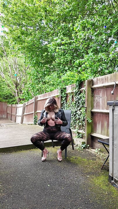Crossdresser kellycd2022 in black leather jacket and lace catsuit and heels