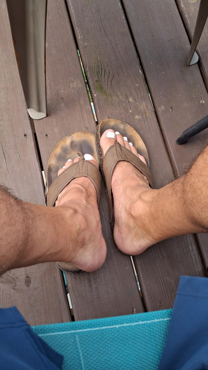 Showing off my dirty worn leather sandals and my cute painted toes