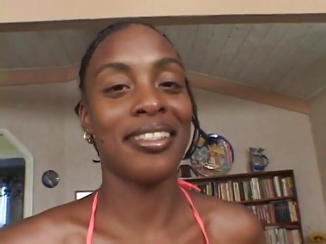 Horny ebony sits on a big white dick and fucks it hard with her pussy