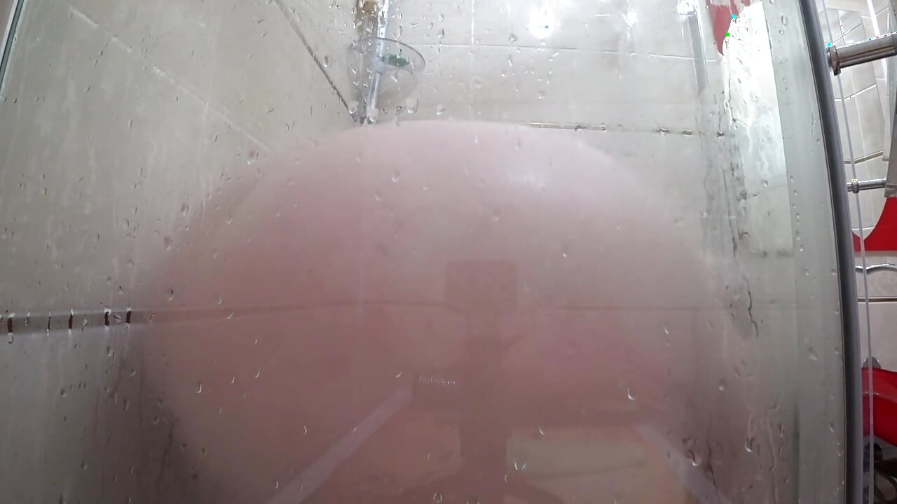 The camera is watching a mature chubby milf in the shower. Gorgeous fat ass, big natural boobs, hairy pussy. PAWG.