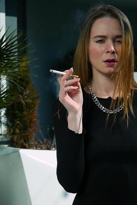 Young Russian Girl Smoking Cigarette by Seaside