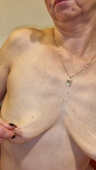 She plays with her saggy tits and big nipples and I watch her and masturbate | Clip 2