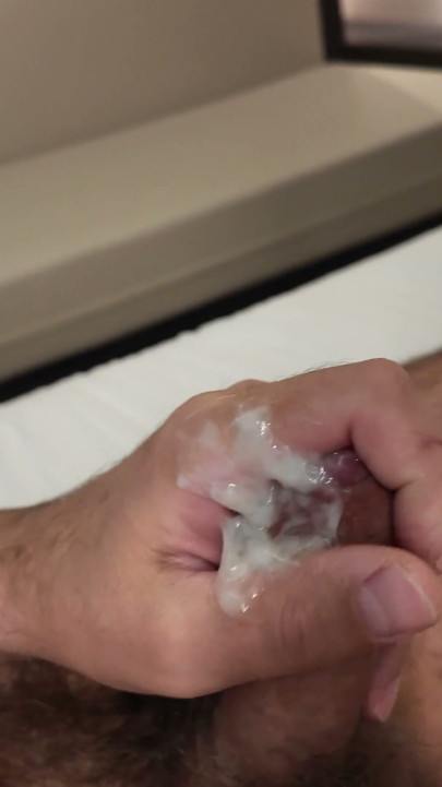 Hairy man masturbates on the bed and cums on his dick | Clip 3
