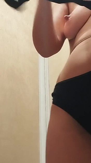 Stunning moment from "Naughty sexy milf tries on naked clothes. Hairy latina pussy tries on clothes in bed."